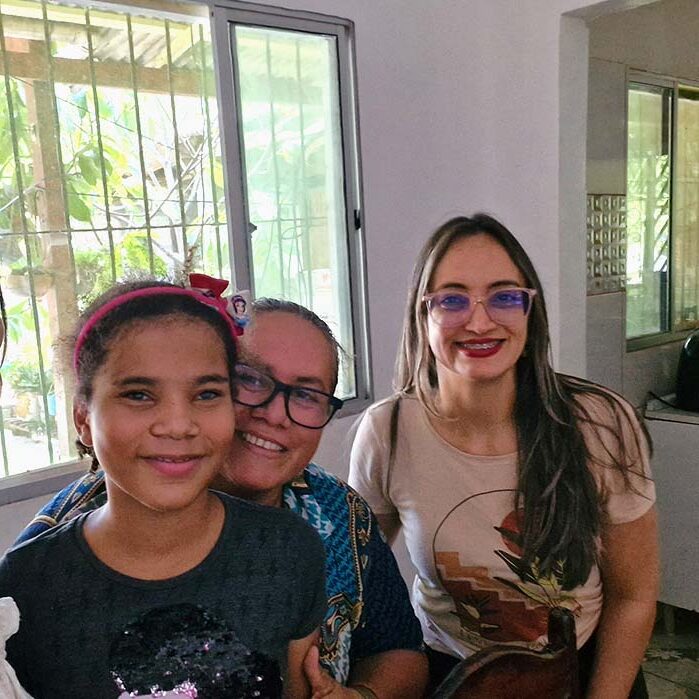 3 adults and a child posing for a photo